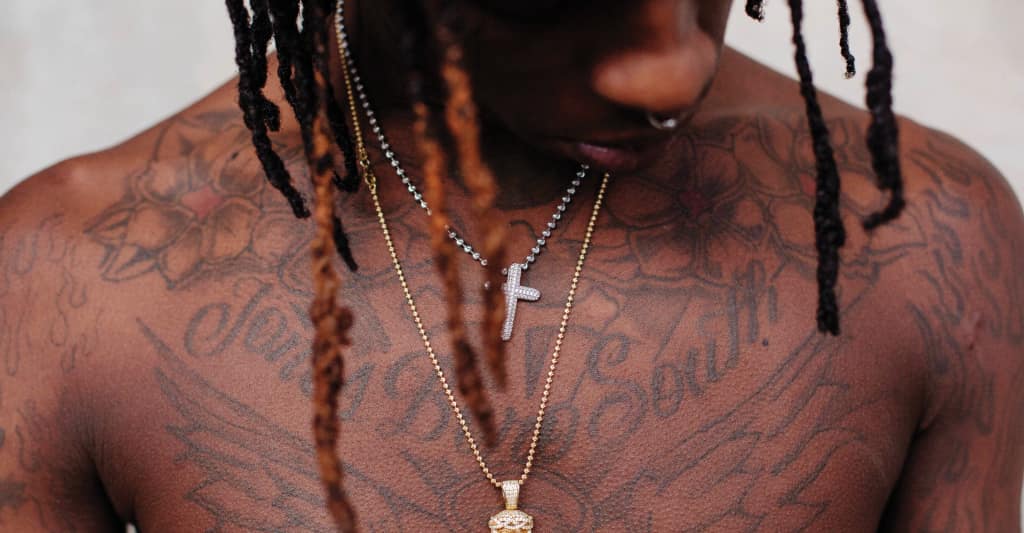 Young Thug chest script tattoos