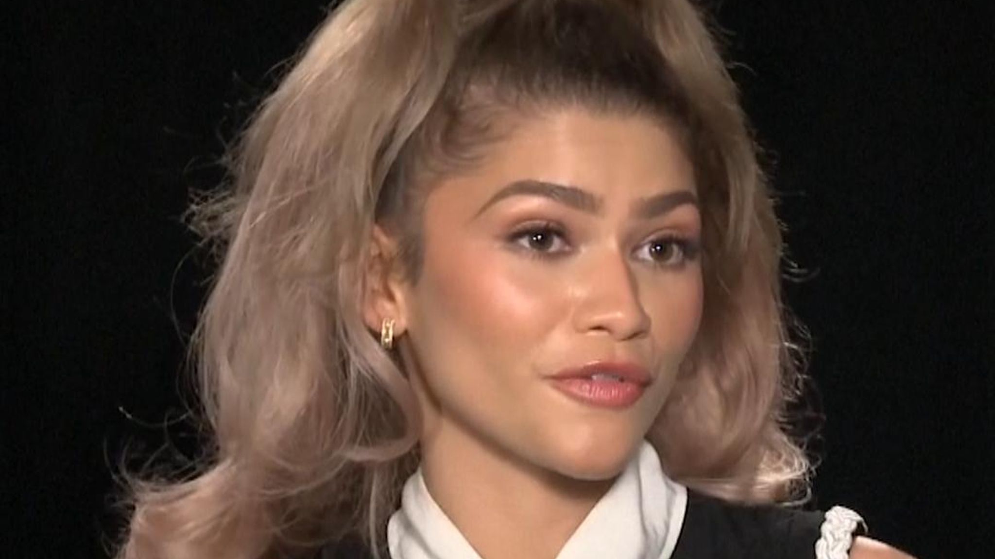 Zendaya in a Challengers interview (contextual, not tattoo evidence) Zendaya in a contextual photograph: Contextual interview still with Zendaya’s face clearly visible; it does not show tattoo evidence.; not tattoo evidence