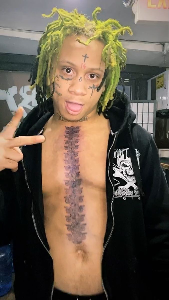 ZillaKami cross and chest tattoos