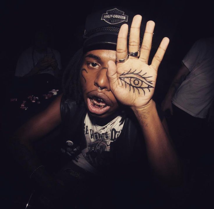 ZillaKami eye palm tattoo
