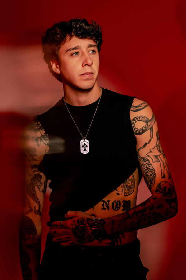 ZUEZEU tattoos: shoulder and upper-arm tattoo evidence